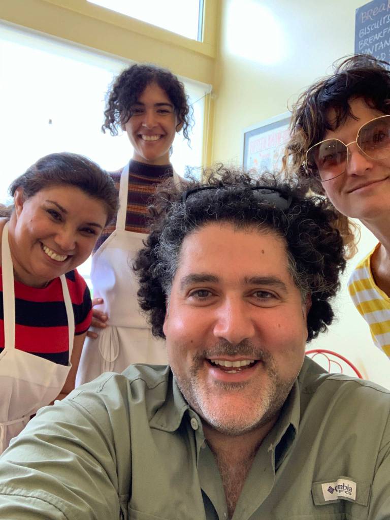 The biggest smile in this picture comes from Venucia who immigrated from Brazil to Red Lodge, MT. She bakes and serves delicious food in a small café, and loves meeting all her customers.