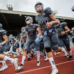 The Meadowvale team runs out on to the field before that start of a game against Shorewood on Sept. 13, 2019, at Edmonds Stadium. (Olivia Vanni / The Herald)
