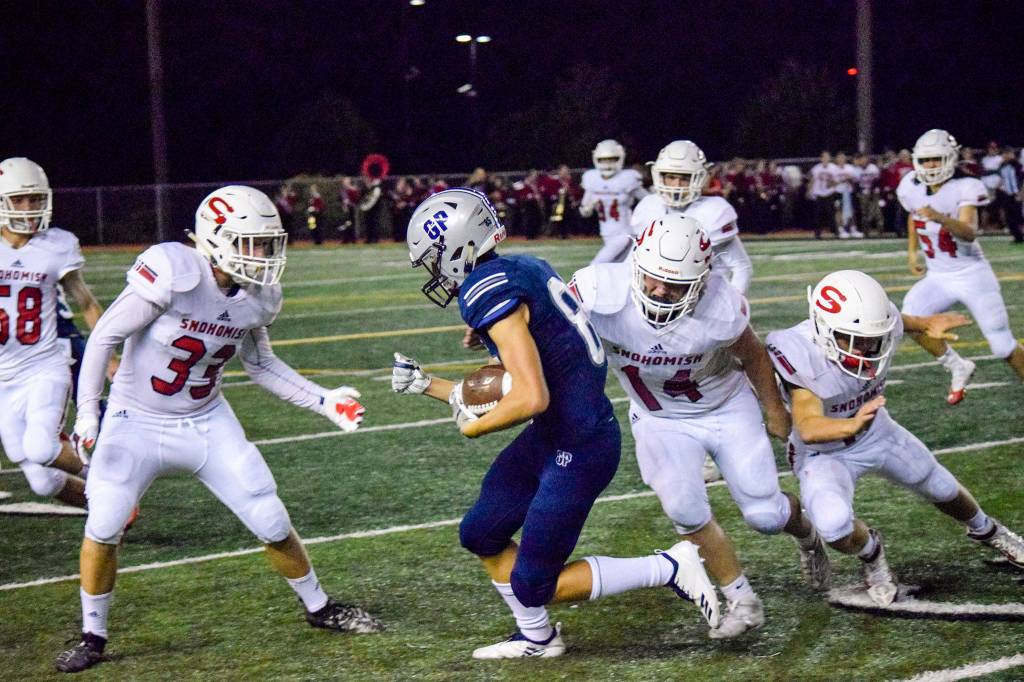 Junior wide receiver Matt Torgeson runs for a first down against Snohomish on Friday, Sept. 13 at Veterans Memorial Stadium. (Katie Webber / The Herald)