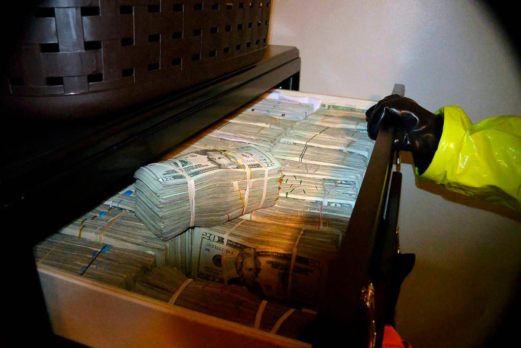 This photo shows money found in Aaron Shamos home. (U.S. Attorneys Office, Utah, via AP)
