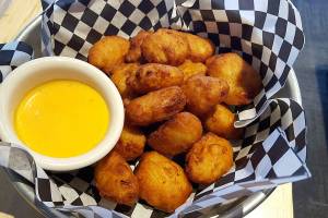 Swing for tasty bites with your virtual golf at Back9 Parlor