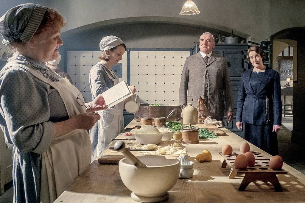 Lesley Nicol as Mrs. Patmore, Sophie McShera as Daisy, Jim Carter as Mr. Carson and Phyllis Logas as Mrs. Hughes in Downton Abbey. (Jaap Buitendijk/Focus Features)
