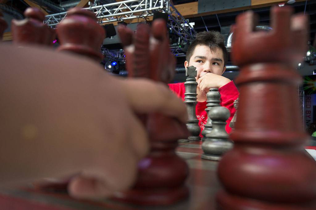 Davian Calkins watches as his opponent considers moving a knight during a chess game on Wednesday at the new multimedia teen center at the Tulalip Boys Girls Club. (Andy Bronson / The Herald)
