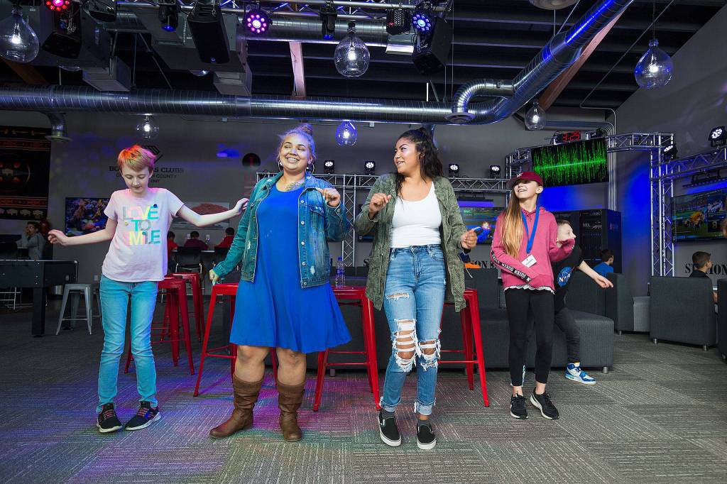 Visitors dance during opening day of the multimedia teen center at the Tulalip Boys Girls Club. (Andy Bronson / The Herald)