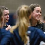Arlingtons Arianna Bilby (rear left) and Reese Talbot (rear right) listen during a huddle between games of a match against Shorecrest on Sept. 17, 2019, in Arlington. (Andy Bronson / The Herald)