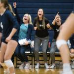 Arlingtons Reese Talbot (center) and Arlington head coach Whitney Williams (left) cheer after the Eagles score a point during a match against Shorecrest on Sept. 17, 2019, in Arlington. (Andy Bronson / The Herald)
