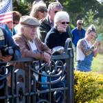 A crowd of people watch the Grand Avenue Park Bridge as it is slowly rotated into place along Marine View Drive on Wednesday in Everett. (Andy Bronson / The Herald)
