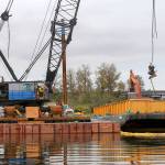 Scrap metal is loaded onto a barge. Removal of the Midas should be complete by early next week. (Kevin Clark / The Herald)