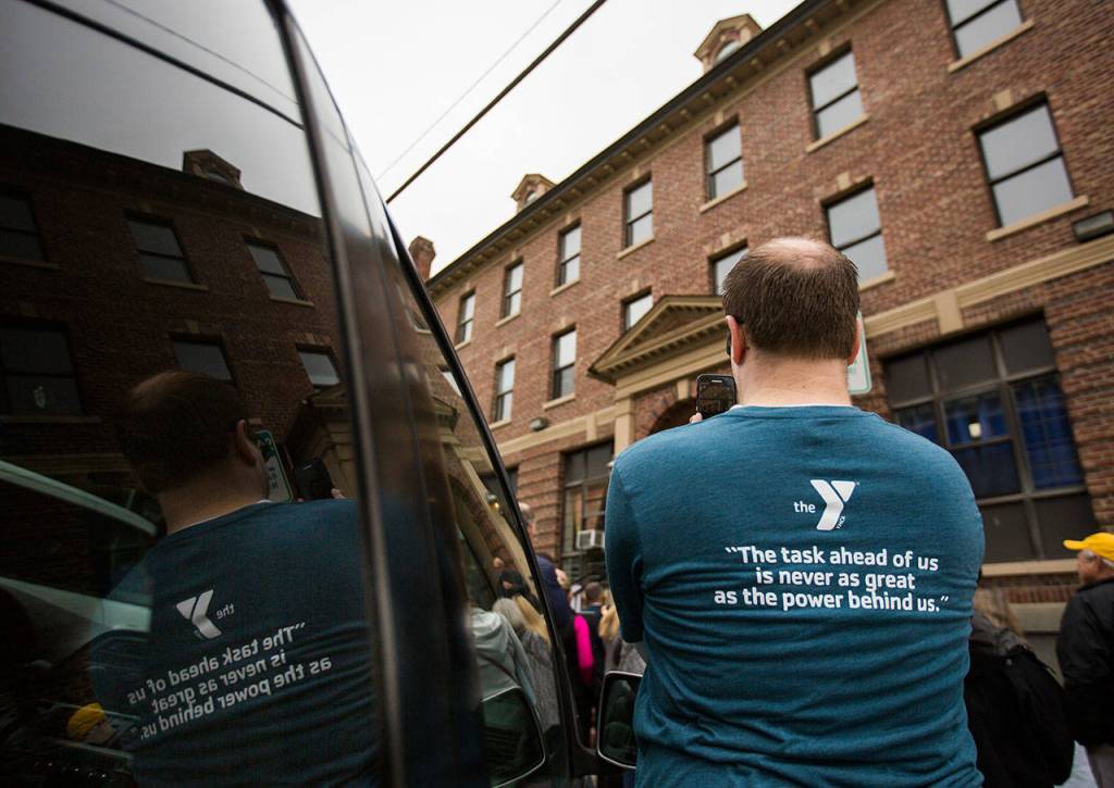 A supporter films part of the YMCAs time capsule ceremony on Saturday, Sept. 21, 2019 in Everett, Wash. (Olivia Vanni / The Herald)