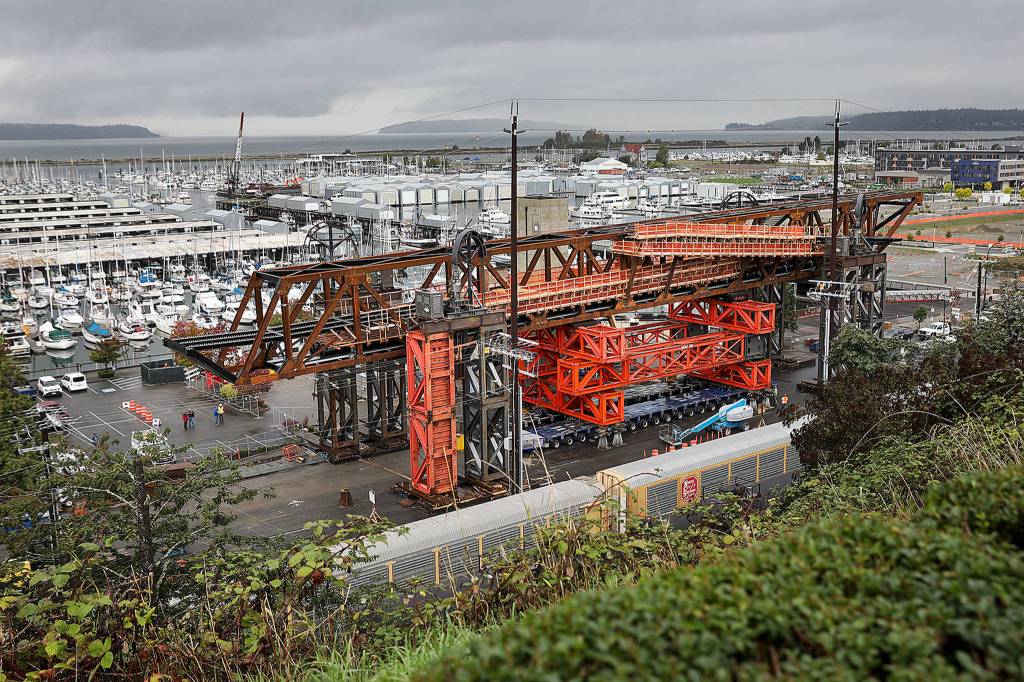 The Grand Avenue Park Bridge was lifted late Sunday night. It will tower over West Marine View Drive for several days before it is rotated into place. (Lizz Giordano / The Herald)