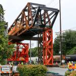 Work continues Monday in Everett on the Grand Avenue Bridge in preparation for the move later this week. (Kevin Clark / The Herald)