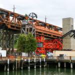 Work continues Monday in Everett on the Grand Avenue Bridge in preparation for the move later this week. (Kevin Clark / The Herald)