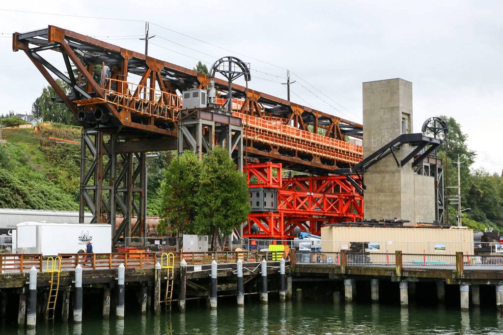 Work continues Monday in Everett on the Grand Avenue Bridge in preparation for the move later this week. (Kevin Clark / The Herald)