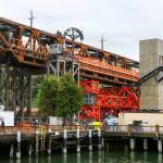 Work continues Monday in Everett on the Grand Avenue Bridge in preparation for the move later this week. (Kevin Clark / The Herald)