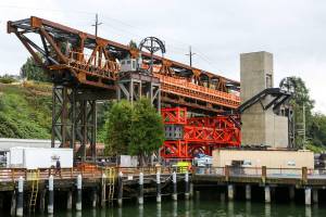 Work continues Monday in Everett on the Grand Avenue Bridge in preparation for the move later this week. (Kevin Clark / The Herald)
