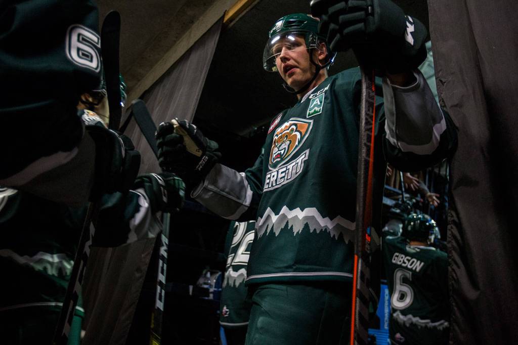 Silvertips Max Patterson fist bumps teammates as they make their way out onto the ice before the game against the Tr-City Americans on Friday, Sept. 20, 2019 in Everett, Wash. (Olivia Vanni / The Herald)
