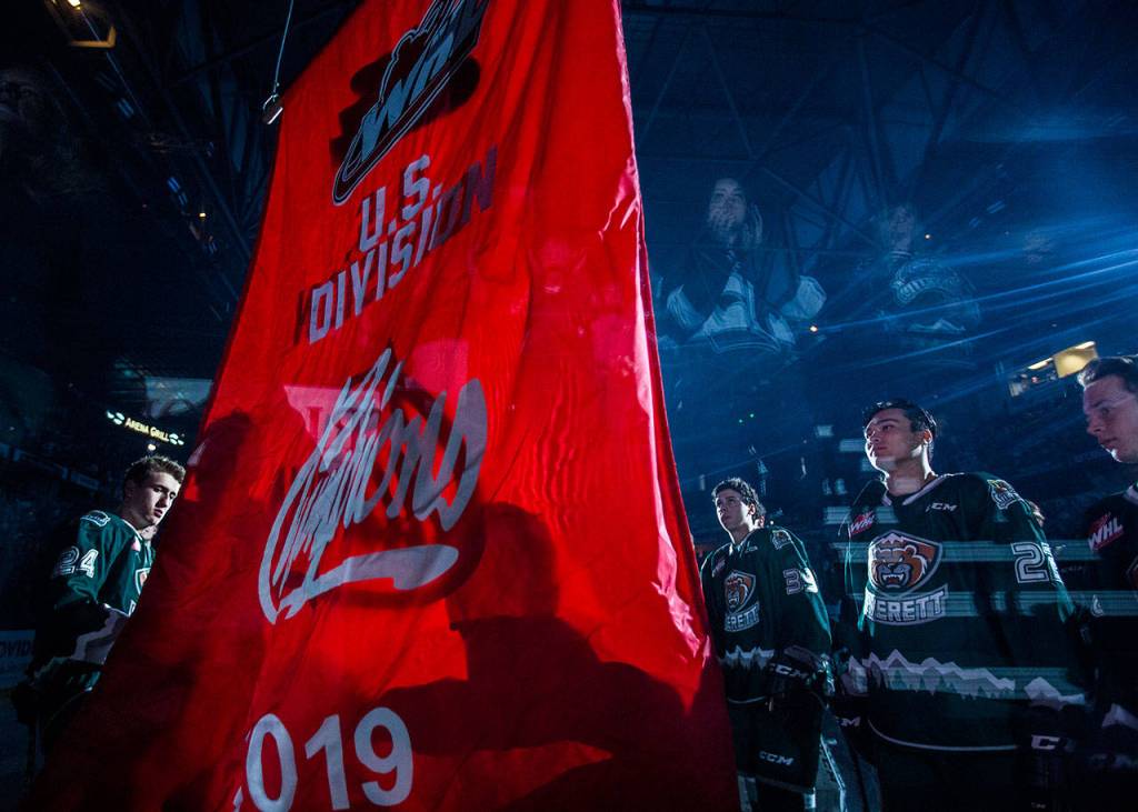 Silvertips players watch as their 2019 U.S. Division Champions banner is raised before the game against the Tr-City Americans on Friday, Sept. 20, 2019 in Everett, Wash. (Olivia Vanni / The Herald)