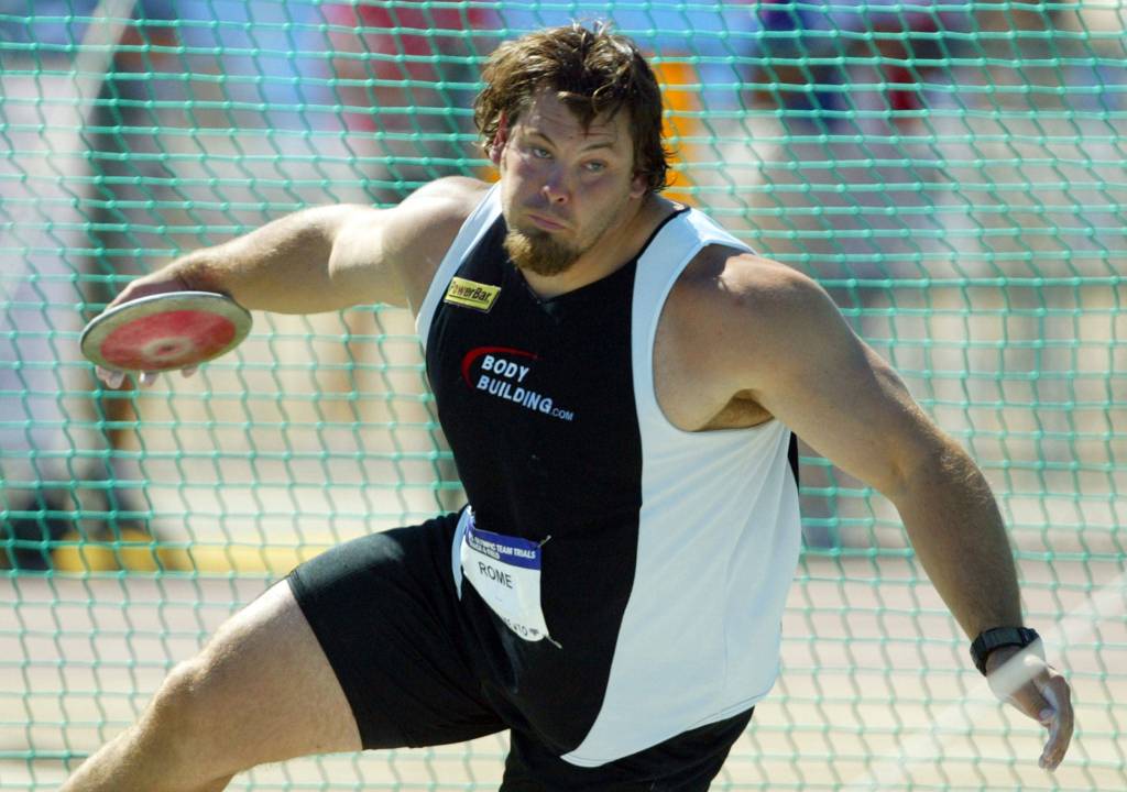 Jarred Rome winds up to throw the discus in the final during the Olympic Track and Field trials in Sacramento, Calif., on July 18, 2004. Rome placed first. (AP Photo/Eric Risberg)