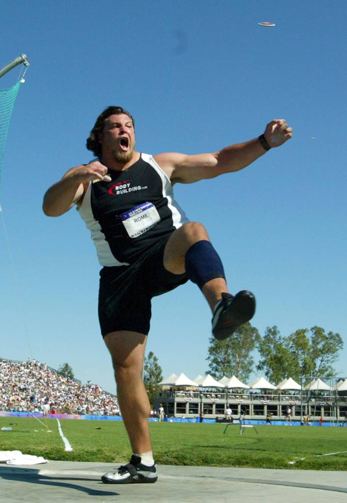 Jarred Rome yells after throwing the discus in the final during the Olympic Track and Field trials in Sacramento, Calif., on July 18, 2004. Rome placed first. (AP Photo/Eric Risberg)