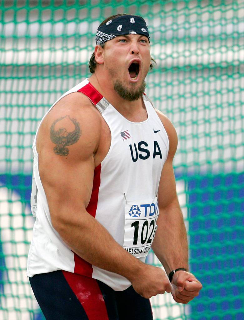 Jarred Rome of the United States shouts out after throwing as he competes in a qualifying round for the mens discus at the World Athletics Championships in Helsinki, Finland, on Aug. 6, 2005. (AP Photo/Martin Meissner)