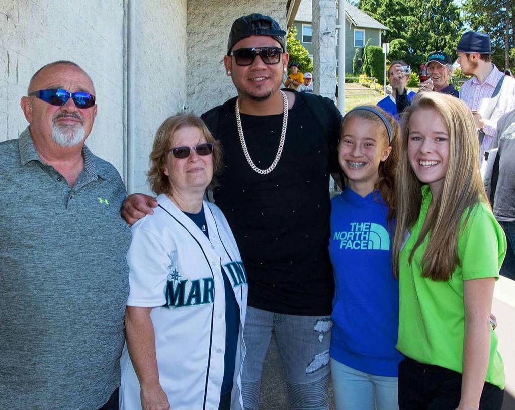 In this photo from 2016, Felix Hernandez poses with the Everett family that hosted him during his first season in professional baseball. From left are Jim Chapman, Kathy Chapman, Hernandez and the Chapmans granddaughters, Dezirae Pearson and Jazmyn Taylor. (Courtesy of Kathy Chapman)