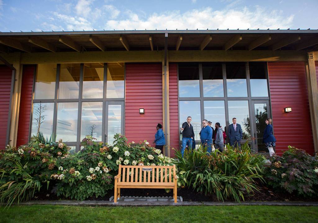 People admire the bench at the Rosehill Community Center on Saturday, Sept. 28, 2019 in Mukilteo, Wash. (Olivia Vanni / The Herald)