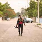 Marchánt Davis plays the leader of a radical but comically harmless group ensnared by bumbling FBI agents in The Day Shall Come. (Film4 Productions)