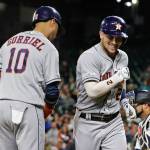 The Astros Alex Bregman (right) reacts at the plate with Yuli Gurriel (10) after Bergman hit a solo home run during the fourth inning of a game against the Mariners on Sept. 24, 2019, in Seattle. (AP Photo/Ted S. Warren)