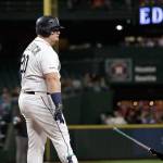 The Mariners Daniel Vogelbach throws his bat down after striking out against the Astros to end the fifth inning of a game Sept. 25, 2019, in Seattle. (AP Photo/Elaine Thompson)