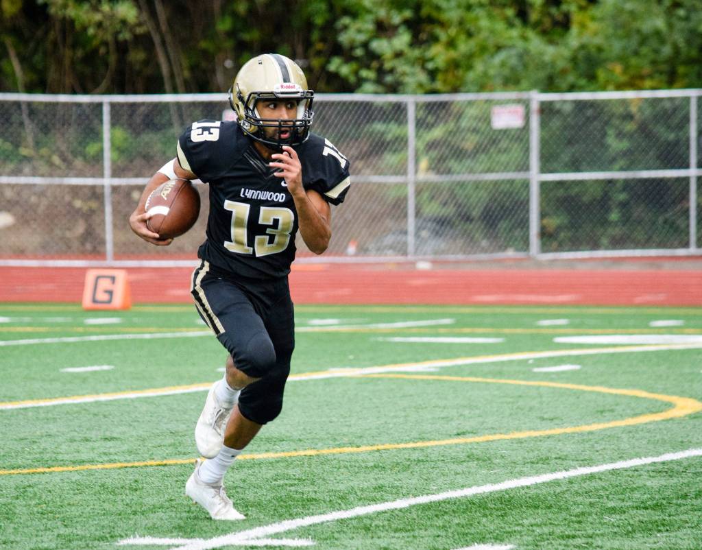 Lynnwood senior Zayn Alrobae returns the ball for Lynnwood against Juanita on Friday, Sept. 27 at Edmonds Stadium. (Katie Webber / The Herald)