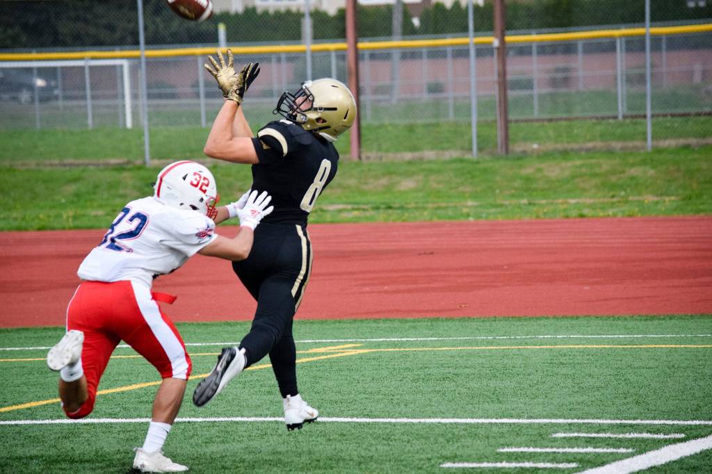 Lynnwood junior wide receiver Tanner Fahey catches Lynnwoods first touchdown for the night against Juanita on Friday, Sept. 27 at Edmonds Stadium. (Katie Webber / The Herald)