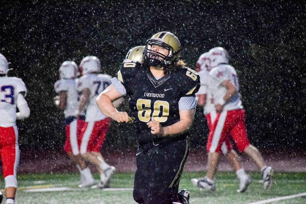 Lynnwood junior defensive lineman Makiah Carey celebrates after Lynnwoods safety against Juanita on Friday, Sept. 27 at Edmonds Stadium. (Katie Webber / The Herald)
