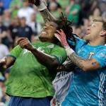 Seattle Sounders defender Roman Torres (left) and Portland Timbers goalkeeper Steve Clark collide as they leap for the ball during the second half of an MLS match, Sunday, July 21, 2019, in Seattle. The Timbers won 2-1. (AP Photo/Ted S. Warren)