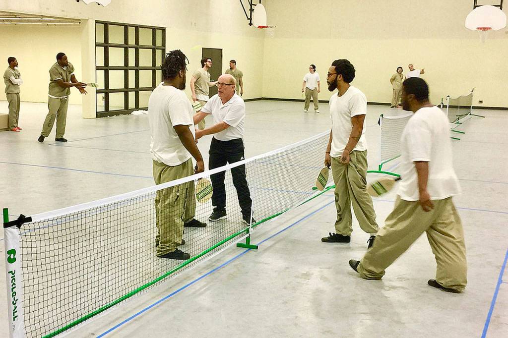Edmonds pickleball player Roger BelAir, 72, has been to the Cook County Jail in Chicago three times since 2017 to teach the game to inmates. He says it builds teamwork and relieves stress. He has taught the game at other prisons, paying for the trips himself. (Submitted photo)