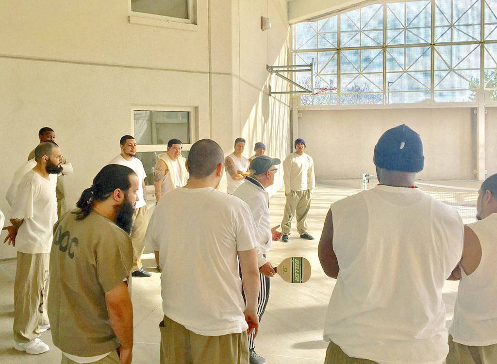 Edmonds pickleball player Roger BelAir, 72, has been to the Cook County Jail in Chicago three times since 2017 to teach the game to inmates. He says it builds teamwork and relieves stress. He has taught the game at other prisons, paying for the trips himself. (Submitted photo)