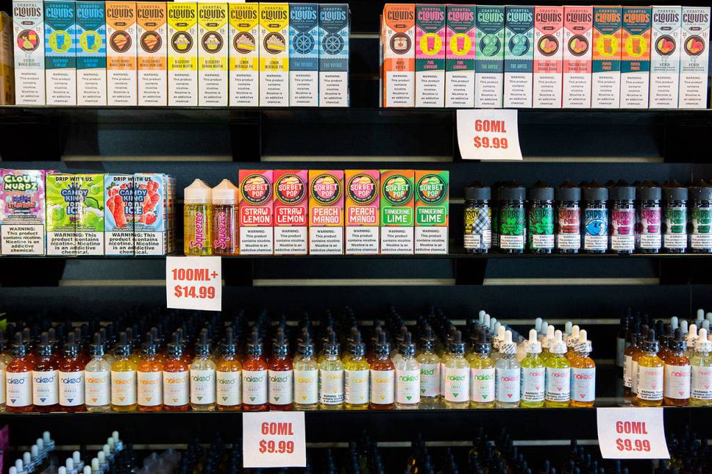 Different brands and flavors of vape juice are on sale at an Everett store in response to the potential ban. (Olivia Vanni / The Herald)