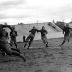 The Everett High School team in action. The game against Bellingham took place Oct. 4, 1913, at Athletic Park Field. Dan Michel is carrying the ball. (Photo by J. A. Juleen/Courtesy of the Everett Public Library)