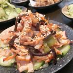 The squid salad is composed of chopped squid atop a bed of sweet and sour cucumber slices at Botan Ramen n Bar in Everett. (Ben Watanabe / The Herald)