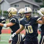 Lynnwood sophomore Nathaniel Johnson celebrates after an onside kick attempt during a game against Juanita on Sept. 27 at Edmonds Stadium. (Katie Webber / The Herald)