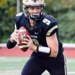 Lynnwood senior quarterback Nate Killen looks for a receiver during a game against Juanita on Sept. 27 at Edmonds Stadium. (Katie Webber / The Herald)