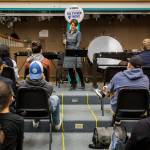 Tracey Paddock, a clarinet player for the U.S. Marine Band, speaks to an Everett High School band class before playing a piece on Friday. (Olivia Vanni / The Herald)