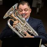 Mark Jenkins, a euphonium player for the U.S. Marine Band, performs for an Everett High School band class on Friday. (Olivia Vanni / The Herald)