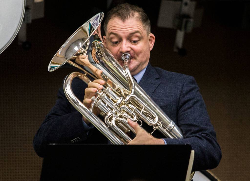 Mark Jenkins, a euphonium player for the U.S. Marine Band, performs for an Everett High School band class on Friday. (Olivia Vanni / The Herald)