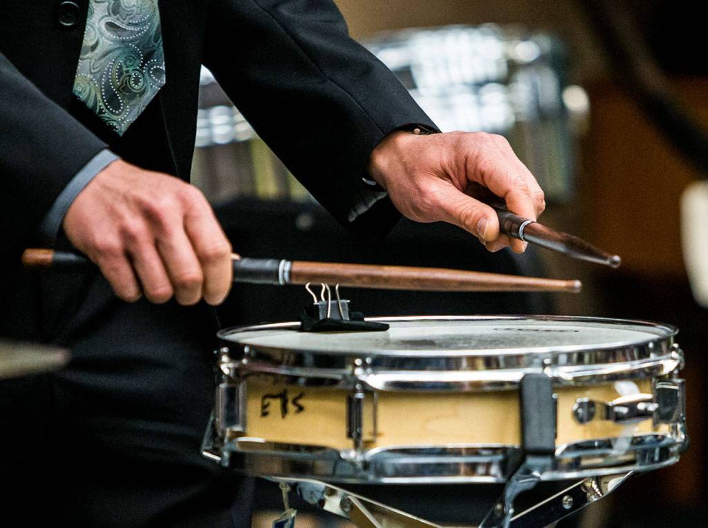 David Constantine, a snare drum player for the U.S. Marine Band, performs for an Everett High School band class on Friday. (Olivia Vanni / The Herald)