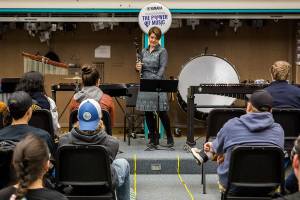 Tracey Paddock, a clarinet player for the U.S. Marine Band, speaks to an Everett High School band class before playing a piece on Friday. (Olivia Vanni / The Herald)