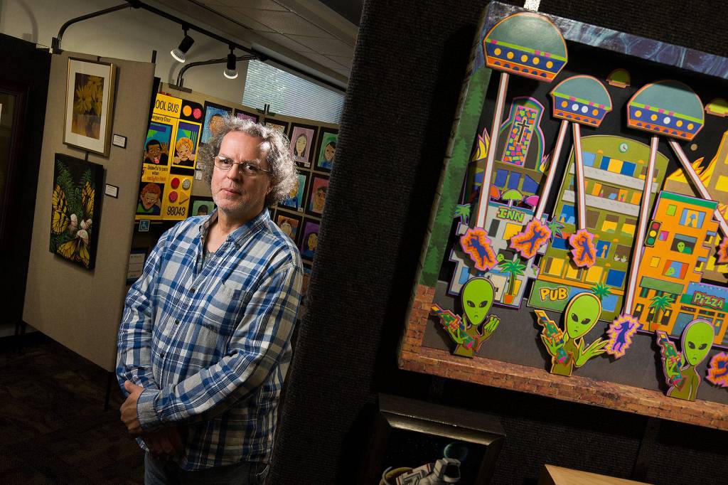 Artist Jerry Steffen Jr.s work is on display at the Mountlake Terrace Library. Steffen took first place in the painting, prints and drawing category at the 2019 Arts of the Terrace for his paper cutouts.                                (Andy Bronson / The Herald)