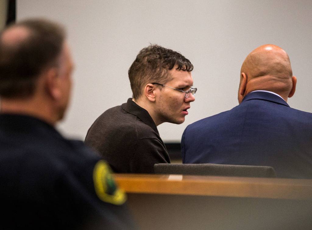 Anthony Garver talks with his attorney during his trial at the Snohomish County Courthouse on Friday in Everett. (Olivia Vanni / The Herald)