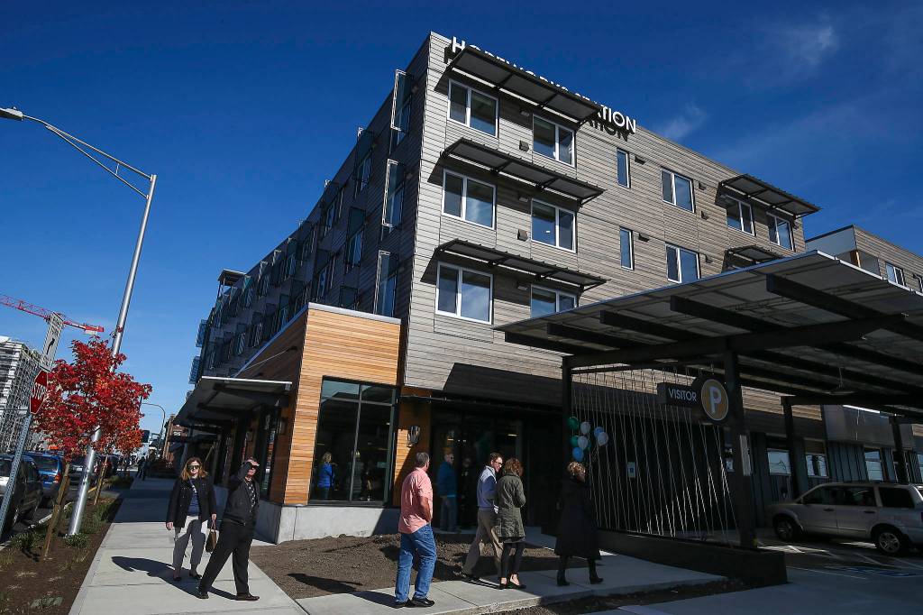 Hundreds of people gathered at HopeWorks Station for an opening ceremony Friday. (Andy Bronson / The Herald)