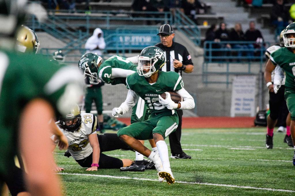 Junior wide receiver Nathan Tesfatsion looks for an opening through the Lynnwood defense on Friday at Edmonds Stadium. (Katie Webber / The Herald)