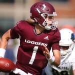 Murdock Rutledge, Everett High alumni and University of Puget Sound junior quarterback, scrambles against George Fox Saturday afternoon in Tacoma on Oct. 5, 2019. (Kevin Clark / The Herald)